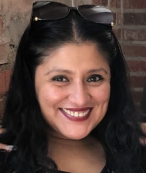 Picture of Johanna, a short Latina Ecuadorian with light skin, dark brown eyes, and long black hair.