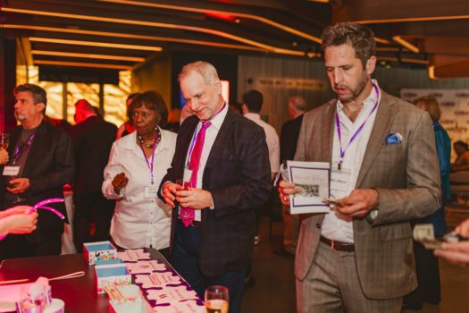 Gala attendees browse auction items.