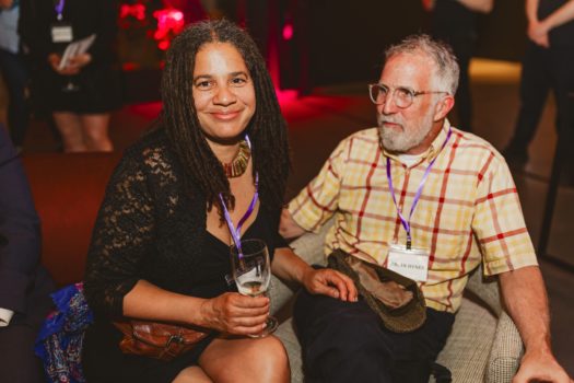 Gala attendees seated listening.