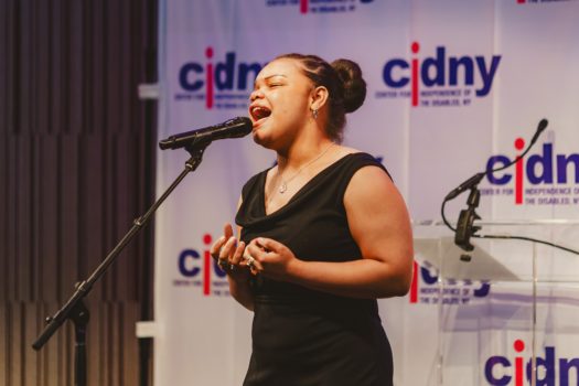 Guest performer singing.