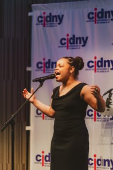 Guest performer singing.