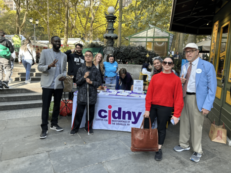 CIDNY staff and voting advocates handing out voting materials in Bryant Park.